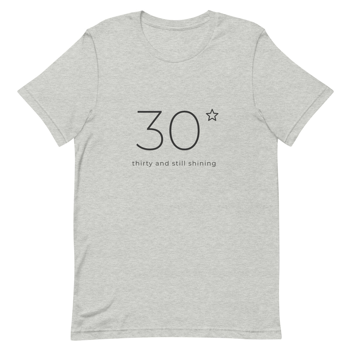 Front of the Thirty and Still Shining 30th birthday tee: a large fine line 30 with a small star and the words thirty and still shining, on a heather grey Classic Soft Tee
